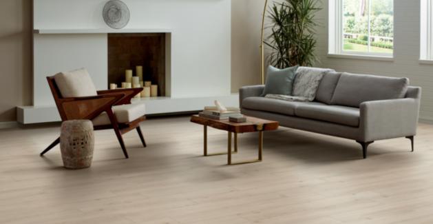 light wood look luxury vinyl plank flooring in living room with midcentury modern furniture.